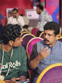 Two attendees in discussion at event